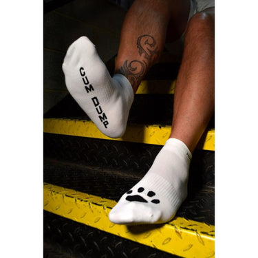 Prowler RED Ankle Sock Cum Dump worn on feet, showcasing a trendy look while paired with sporty attire.